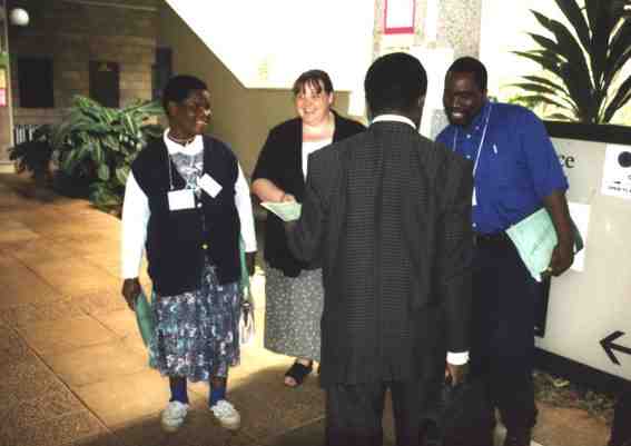 Distributing leaflet to Delegates at COP V